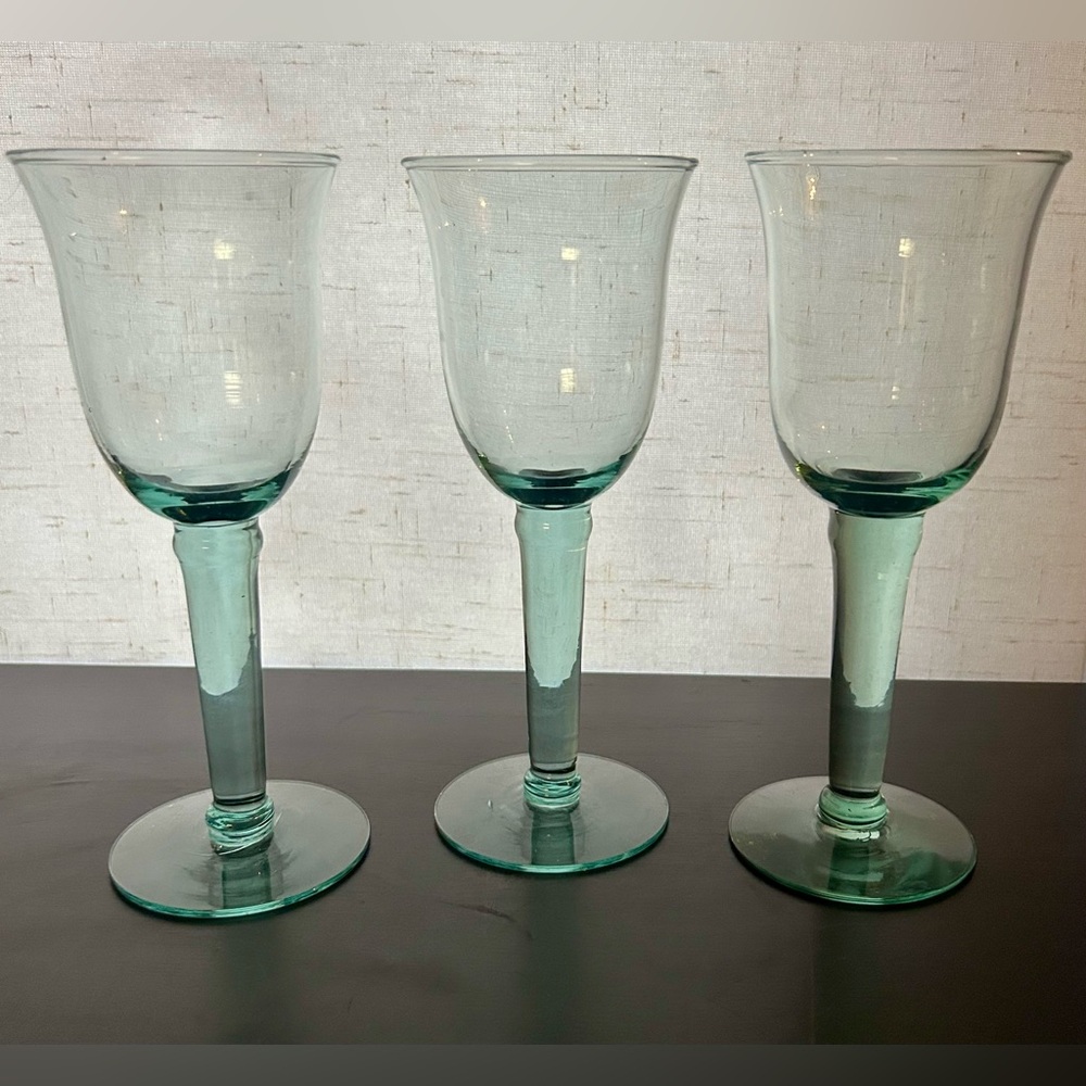 3 hand blown green wine glasses. 7.75”